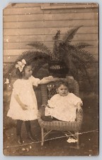 Postcard RPPC Unhappy Children Siblings White Dresses Real Photo