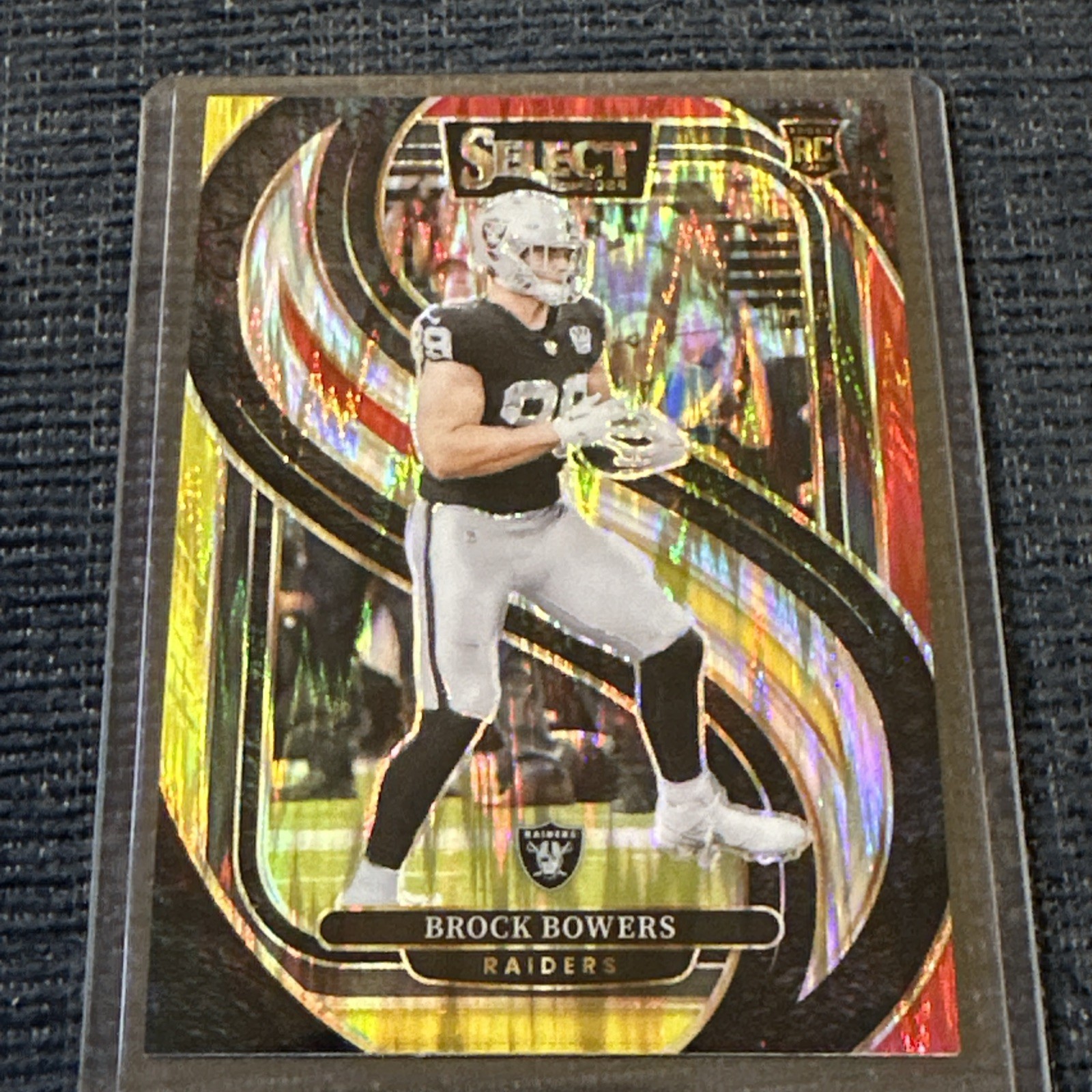 Brock Bowers 2024 Select Premier Level #118 Red & Yellow Shock Prizm RC-Raiders