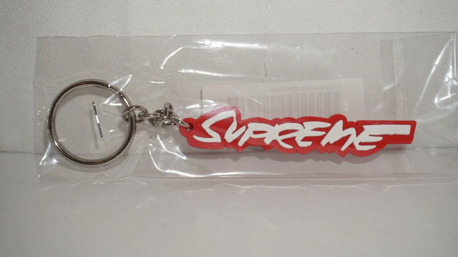 Porte clés Supreme New Futura Logo Rouge FW20
