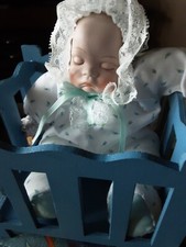 Moving Wind Up Musical Baby In Crib Bisque Hand Painted 10