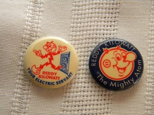2 Vtg Electric Co REDDY KILOWATT Pin Back Buttons~Your Ready Servant~Mighty Atom