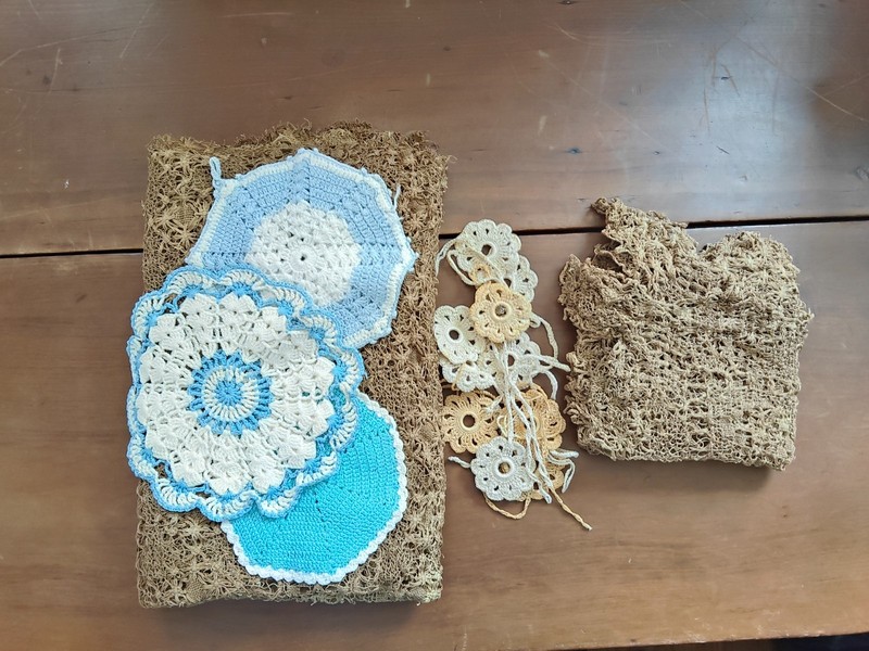 lot of crochet items three pot holders , crocheted flowers,  2 net  tablecloths