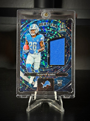 Panini 2023 Spectra Next Era Jahmyr Gibbs Neon Blue Prizm RC MEM /60 Rookie