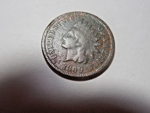 1869 Indian Head Cent solid good. Some corrosion. Strong date. But you decide!!!