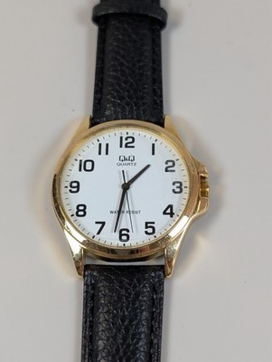 QQ  white dial with gold case and new black leather band