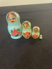 Matryoshka Set of 4 nesting dolls largest is only 3.5' tall hand paint lt green