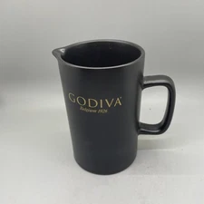 Black stoneware pitcher creamer with Godiva Belgium 1926 on Pitcher