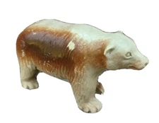 Molded plastic brown tan vintage bear figure TB BT logo, 1 1/2" h, 2 5/8" l