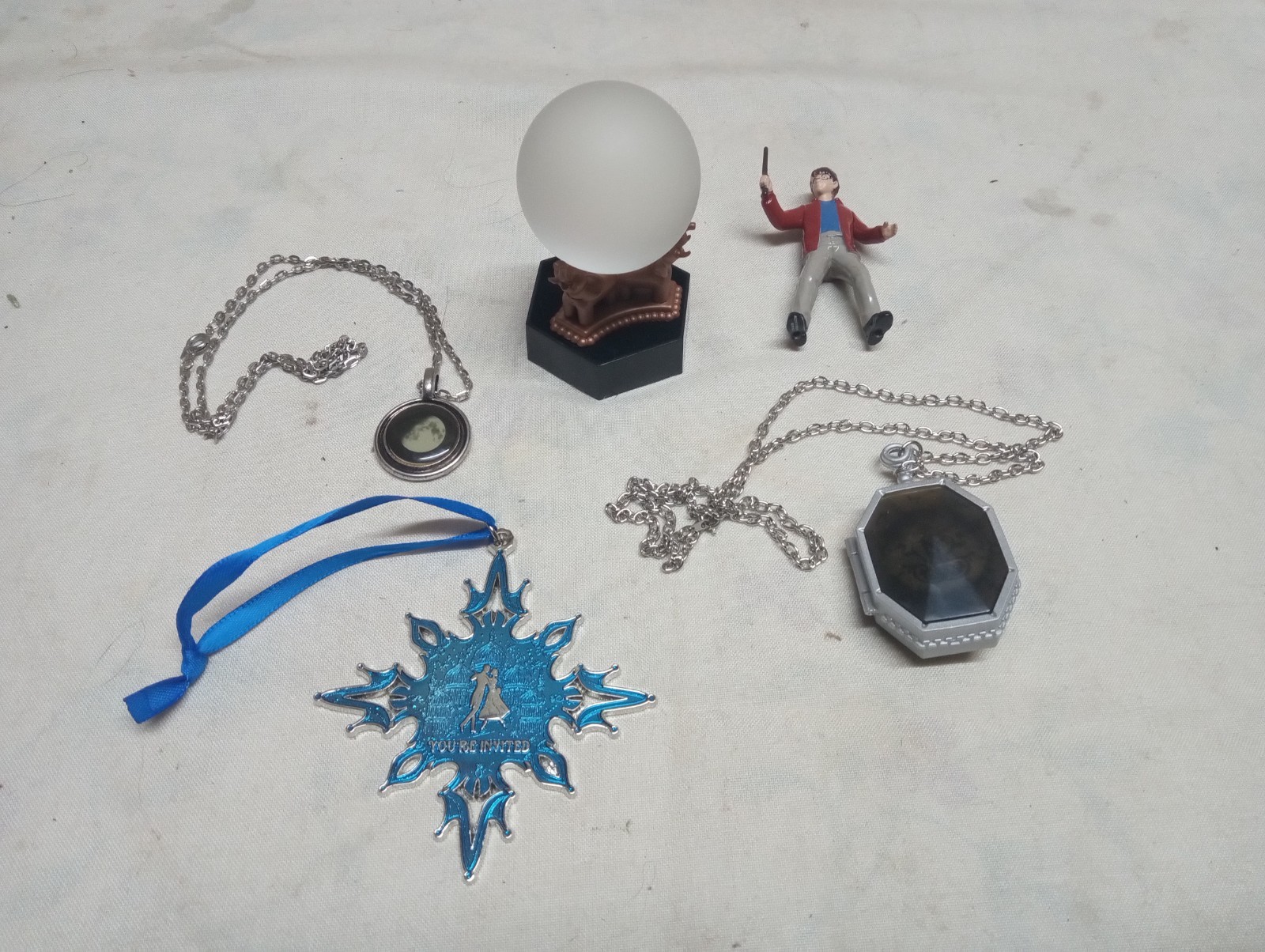 Harry Potter collectible lot, wizarding world trunk orb, pendan, medallion, figu