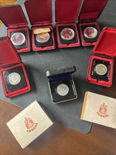 7 PROOF? CANADIAN SILVER DOLLARS ENCAPSULATED WITH ORIGNAL BOXES 1970’s AS SHOWN
