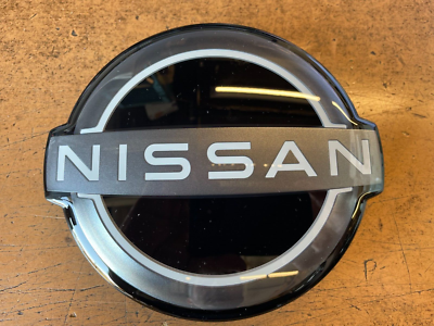 Nissan Rogue Front Grille Emblem 2021-2023 - New Style Outline Badge | Part #62890-6RM0A, Chrome & White