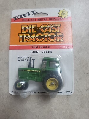 1/64 Ertl John Deere Tractor With Cab & Speed Wheels. NIP