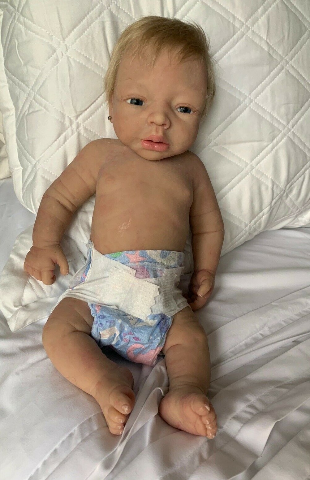 baby snuggles drink and wet doll