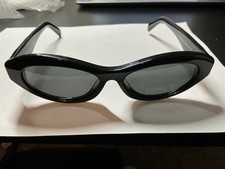 Prada PR 26ZS 16K08Z Women's Oval Sunglasses in Black with Gray Lens NEW