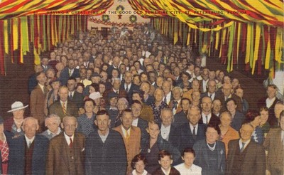 FL~FLORIDA~ST. PETERSBURG~BIG WELL-DRESSED OLDER CROWD ENJOYING CHRISTMAS PARTY