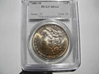 1883-0 Morgan silver dollar, PCGS-MS64, radical gold  toning obverse and reverse