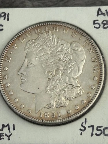 KEY 1891-CC MORGAN SILVER DOLLAR. AU++/UNC, nice perimeter toning/muted luster.