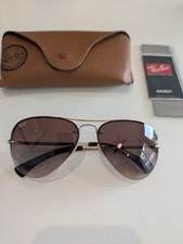 Nuovi occhiali da sole Ray-Ban RB 3449 001/13 lenti sfumate oro marrone.