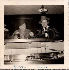 Vtg B&W Photo 1951 Men Bar Drinks Dinner Whiskey Beer Ashtray Home Friends Hat