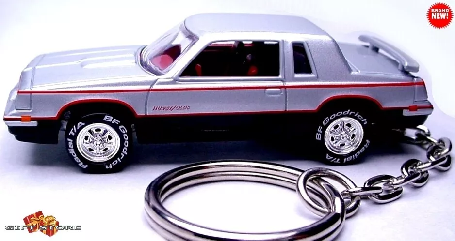 PORTE CLÉS RARE 1983 ARGENT HURST OLDSMOBILE CUTLASS SUPREME LTD JOLI CADEAU ?