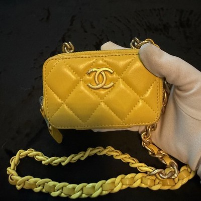 The item in the image is a CHANEL Mini Lacquered Chain Clutch in