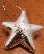 Silver hand-blown mercury glass star ornament with snowflake and embellishments