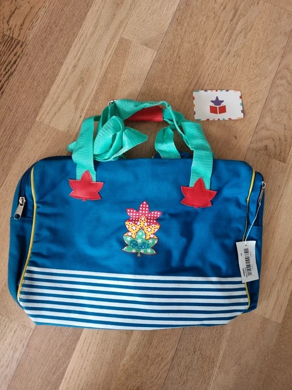 Sac de sport Corolle vintage pour ranger les vêtements de poupon lors des sorties au parc