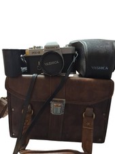 Yashica FX-2 35mm SLR Camera Body with 50mm, 135mm Lenses, Flash And Cases