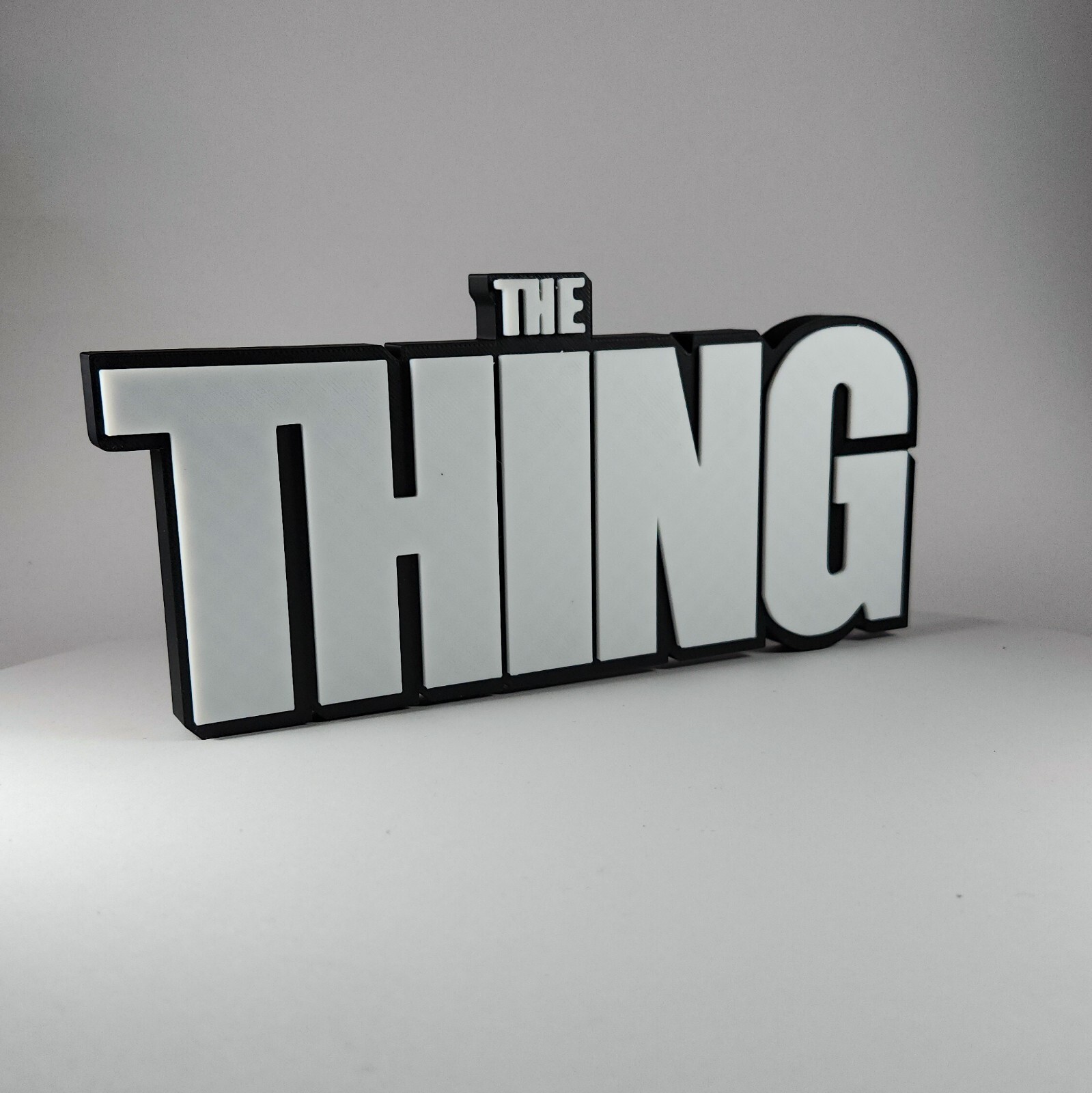 The THING 3D printed in Black & white horror-themed decor for bookcase or shelf