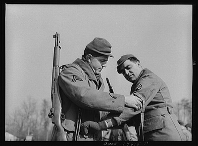 #ad Fort Belvoir Virginia. Corporal adjusting a rifle sling for Sergeant Biviano $9.99