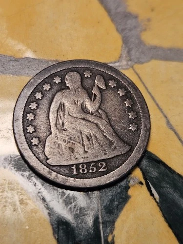 1852 *O* SEATED LIBERTY SILVER DIME IN FINE OR LESS CONDITION