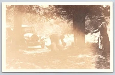 Vintage Real Photo Postcard family in woods antique car 1920s Rppc