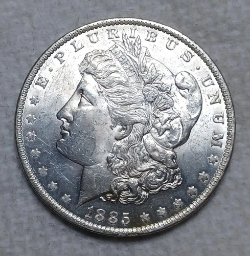 1885 O Morgan Silver Dollar. Estimated Uncirculated Mint State 63. Video M0029.