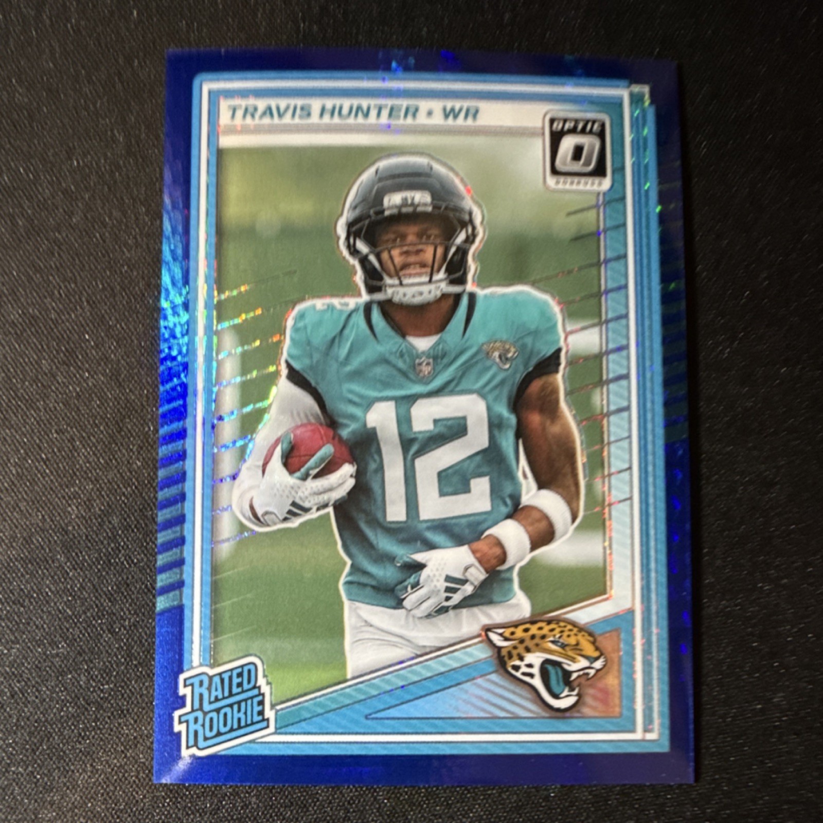 Panini 2025 Donruss Optic Travis Hunter Rated Rookie Blue Hyper #201 Jaguars