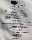 AG Adriano Goldschmied Dylan men’s jeans, W30 L34, in white oak case with black label showing fabric and care instructions.