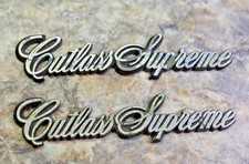 Genuine Vintage 1981-1988 Oldsmobile Cutlass Supreme Script Emblem - Plastic Genuine Vintage 1981-1988 Oldsmobile Cutlass Supreme Script Emblem - Plastic
