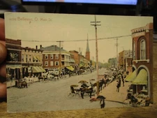 F1 Vintage Old OHIO Postcard BELLEVUE Main Street Grocery Store Buildings Horses