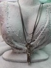 2This is a Brighton cross pendant and chain lanyard, often used as an ID badge — photo 6