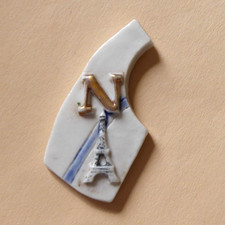 Fève pub perso - Fauchon 2004 - Puzzle Paris - " N " - La Tour Eiffel