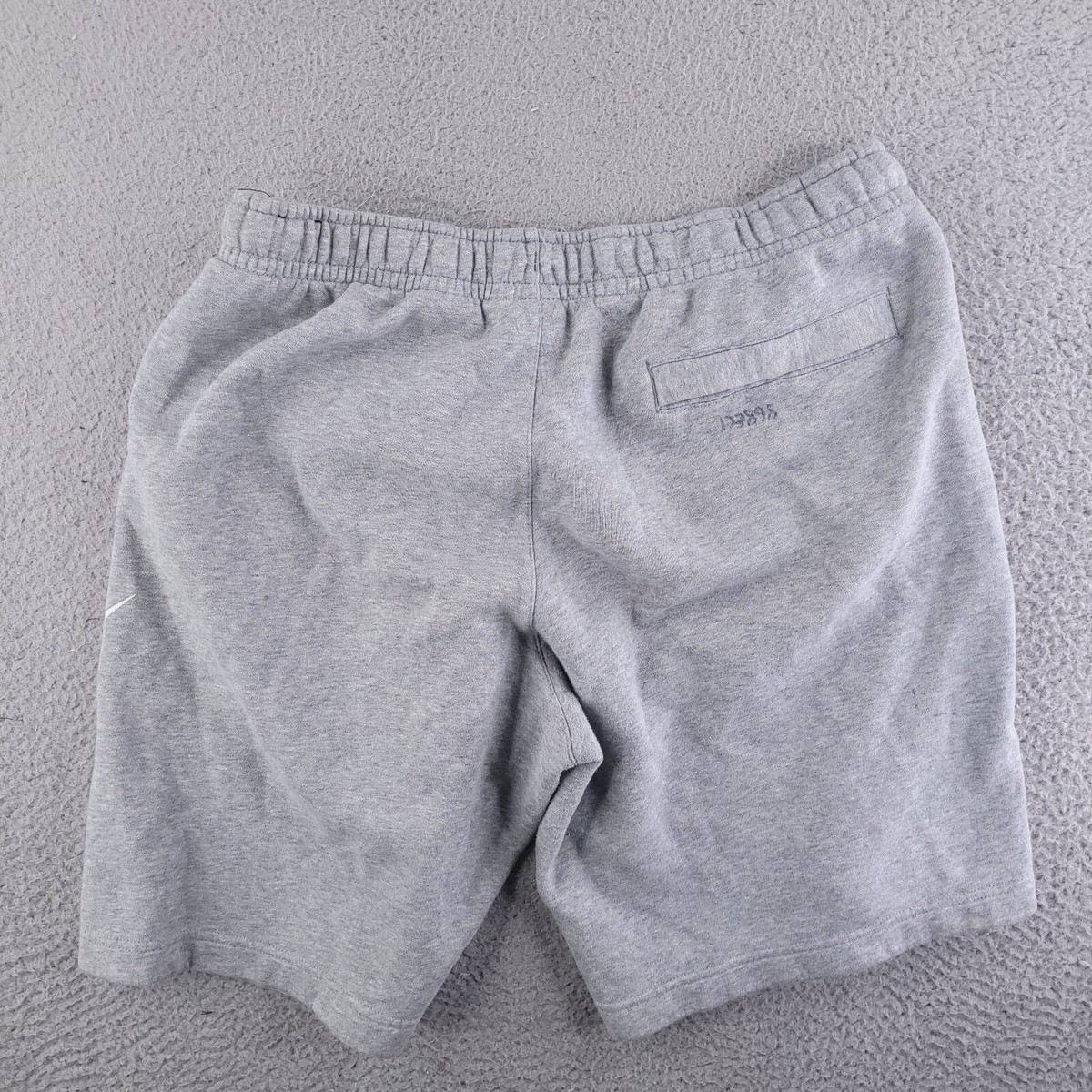 grey nike sweatpants shorts