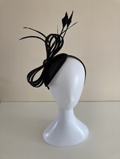  A striking satin dome shaped Fascinator on headband 