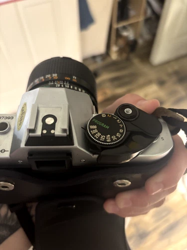 Japanese Cannon Lens FD 100mm 2.8 attached to a Cannon AE-1 Program