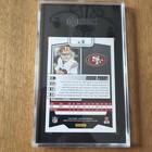 2023 Panini Absolute Color Match Brock Purdy card, white background, red #18 jersey, NFC logo, stats at bottom.