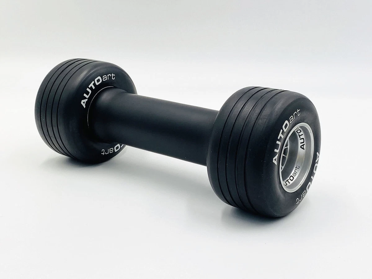 Dumbbells with a formula wheel tire motif. Weight about 2.3 kg