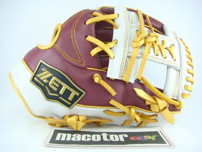 white and gold baseball glove