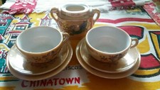 Japan lusterware child's tea set pieces peach color with dragon and floral
