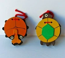 ANIMAL SHAPED WOOD CASTANET LOT. MADE BY OKUYA CO. LABEL ON BOTTOM. TURTLE,CRAB?