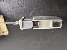 Minota 16 with case and tripod adapter.