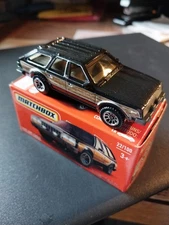 Matchbox 1980 AMC American Motors Eagle (Hornet). Black w/side wood panel. W box