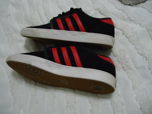 black shoes with red stripes
